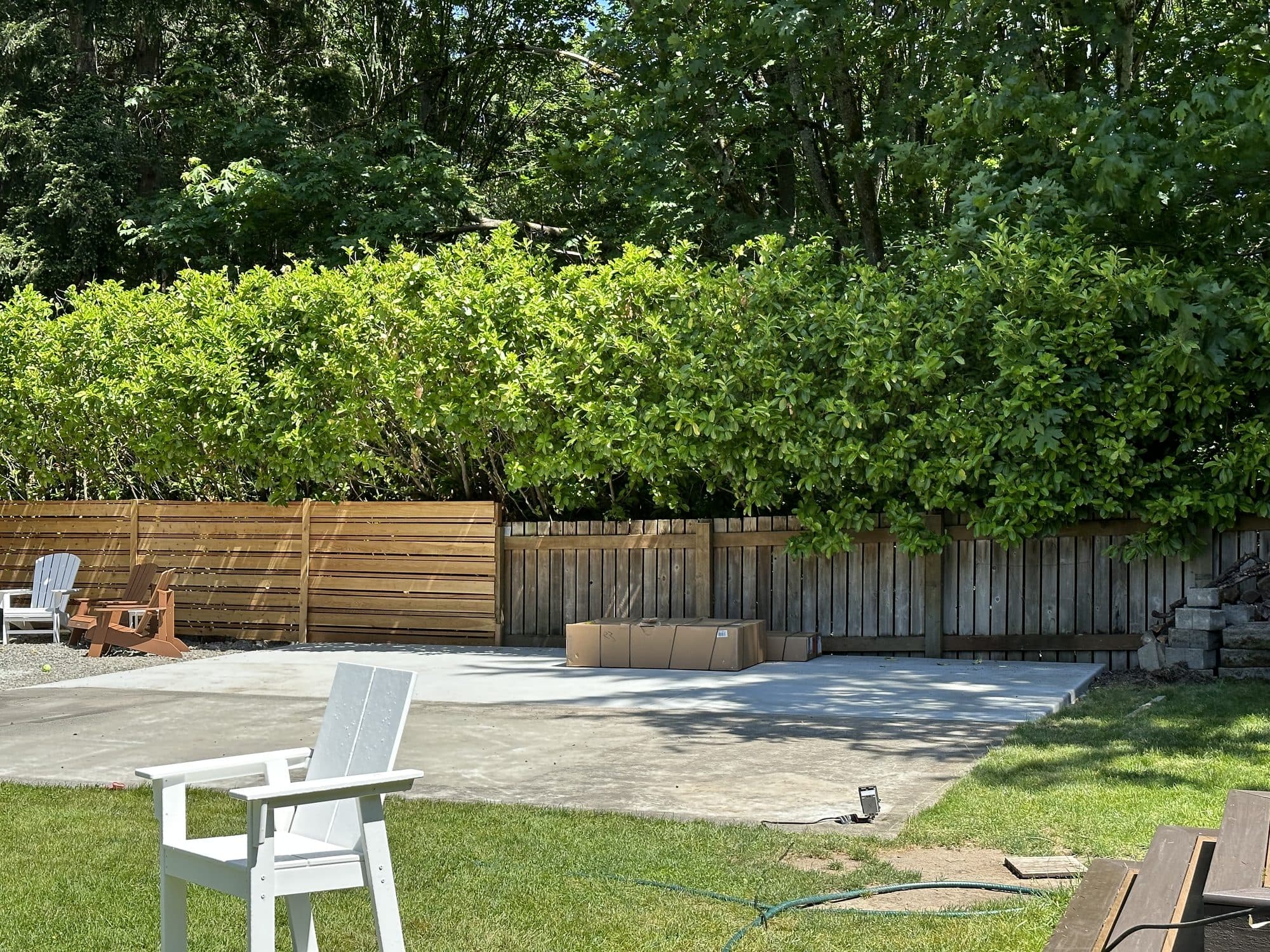 A finished run of fence bordering the patio