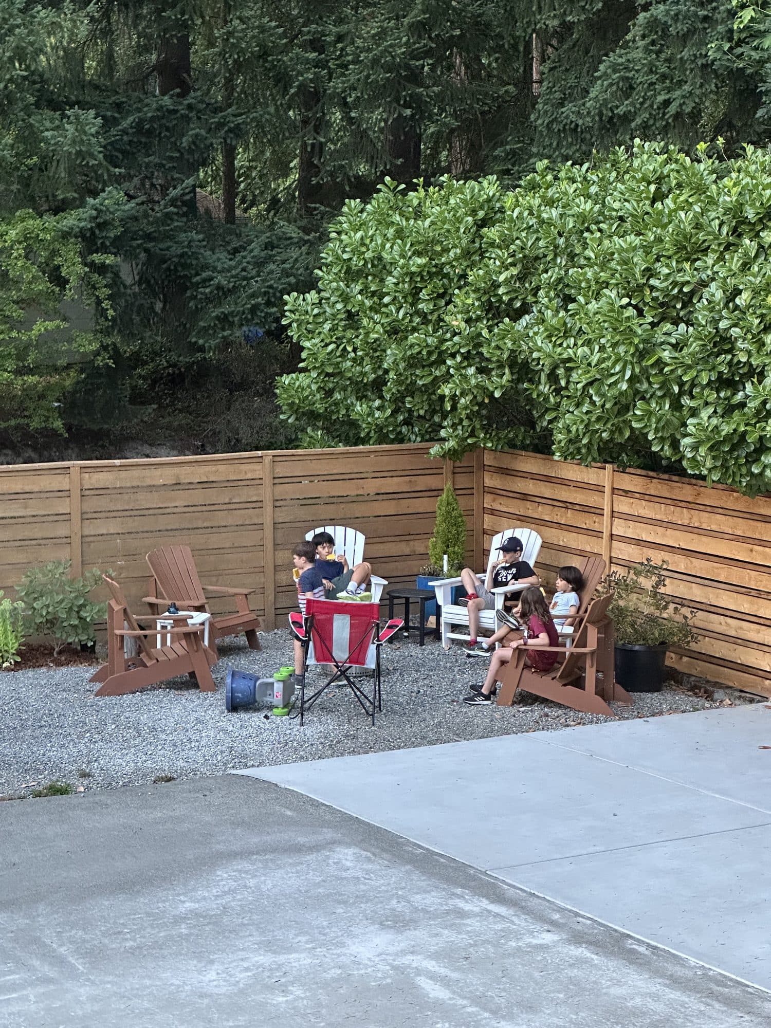 Chairs and lights beside the fence in the evening
